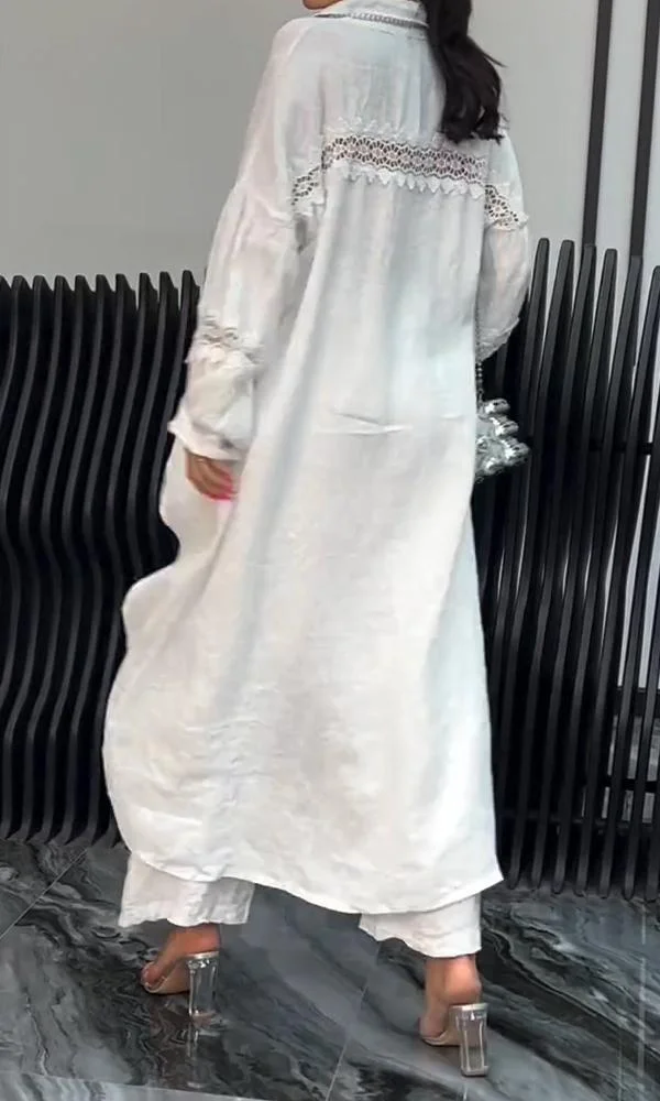 Conjunto de top y pantalón de manga larga con dobladillo irregular